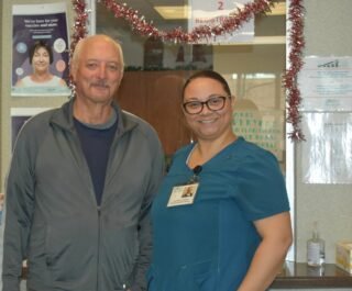 Robert D'Agostino and Patient Service Representative Lydia Martinez.
